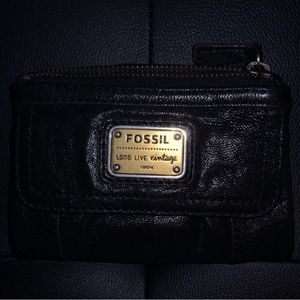 Black fossil wallet used with minimal wear.